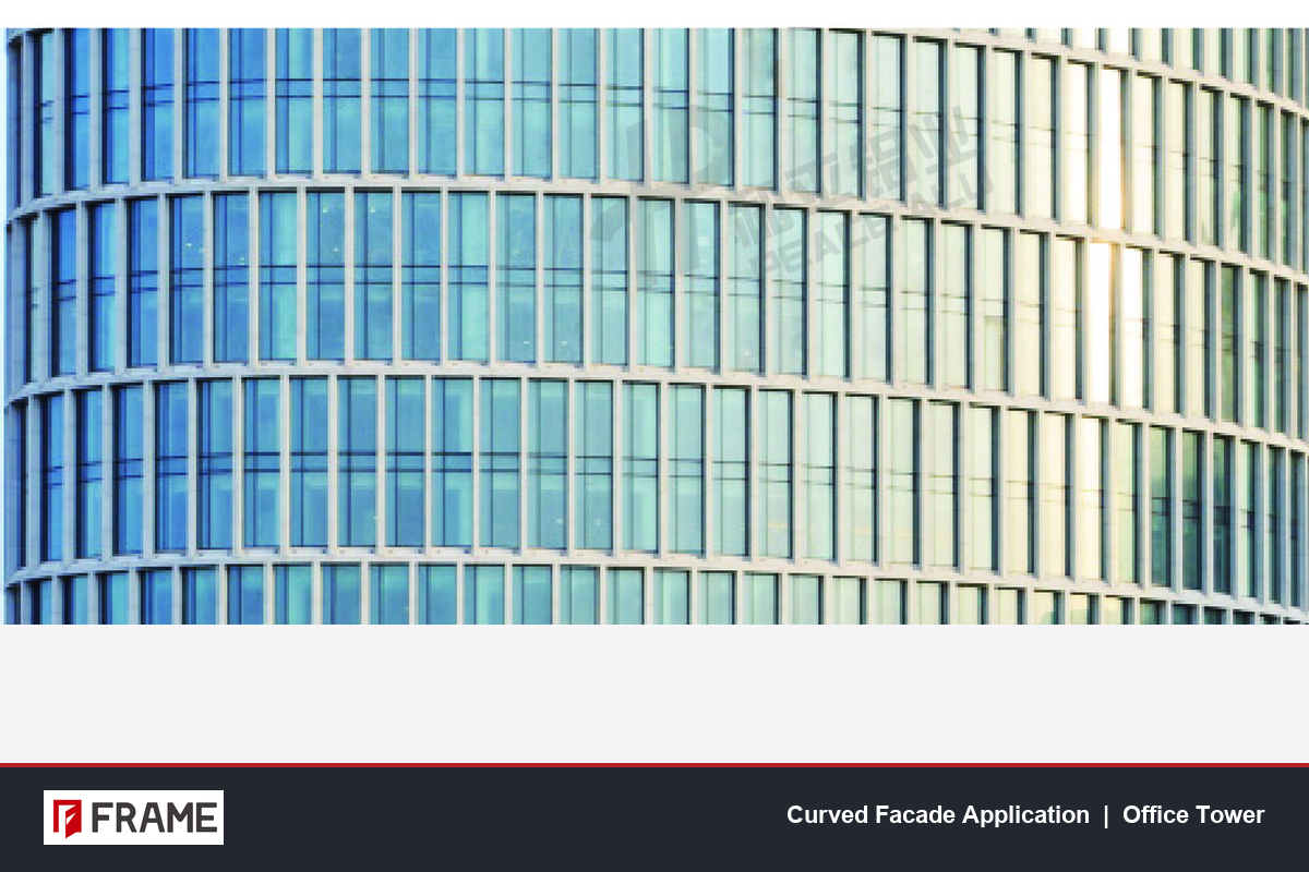 Curved glass curtain wall on an office tower showing how visible aluminium frames follow the building's radius