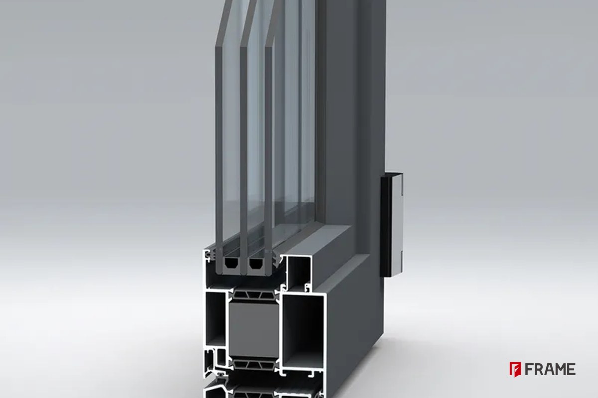 3D cross-section of a FRAME thermal break aluminum door profile showing the insulation strip and glazing pocket