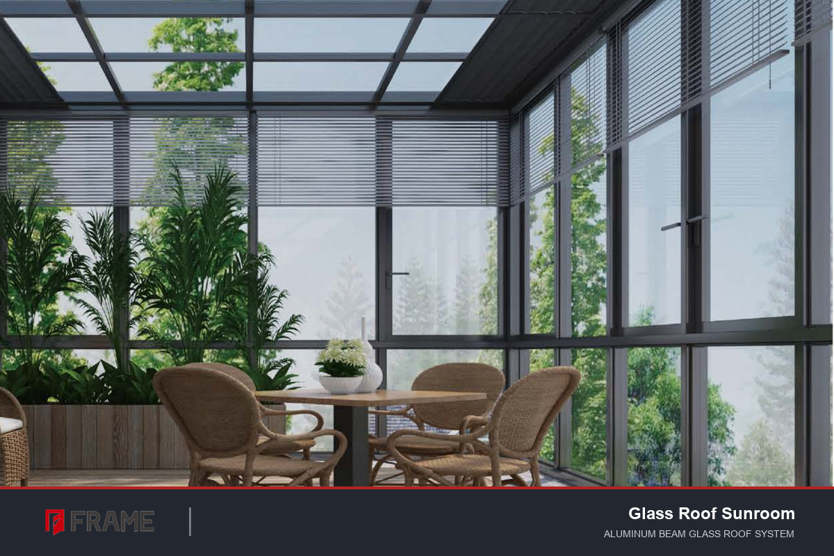 Glass roof aluminum sunroom interior with rattan furniture and plants