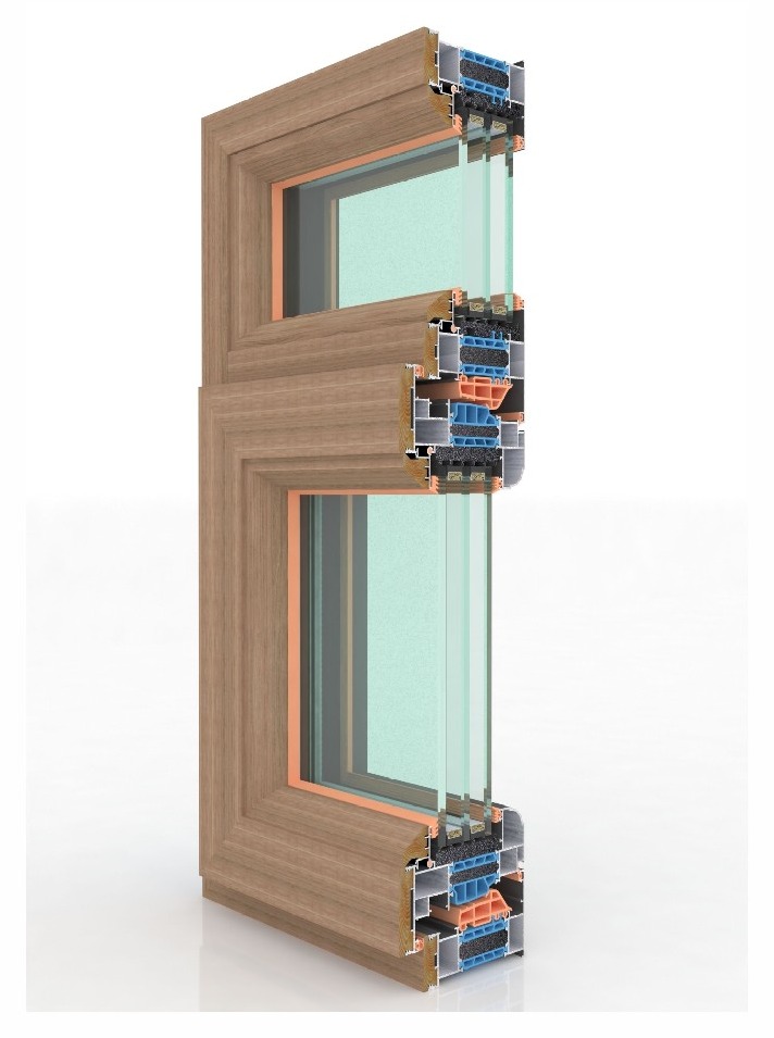 Cross-section of a FRAME aluminum-clad wood window showing aluminum exterior, thermal-break chamber, wood-fiber interior profile and triple insulating glass